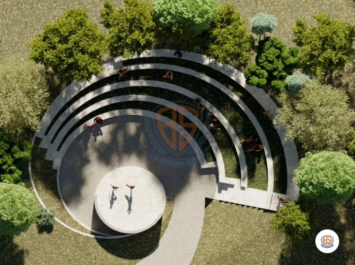 Modern circular academic building with landscaped gardens on the school campus